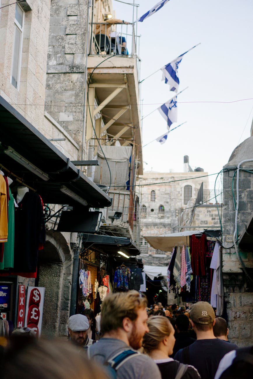 A crowded market scene in Jerusalem's Old City showcasing vibrant street life and local commerce.