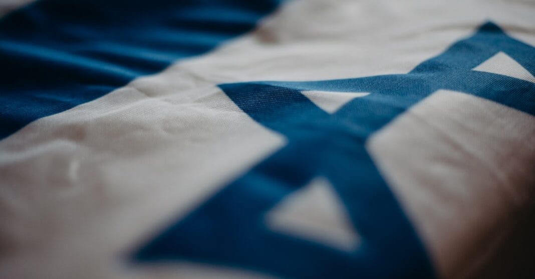Detail of the Israeli national flag highlighting the Star of David, emphasizing its cultural significance.